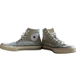 Blue and white high top Converse trainers